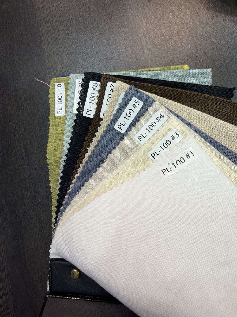Linen swatches fanned out and numbered, as sent to customers choosing cloth